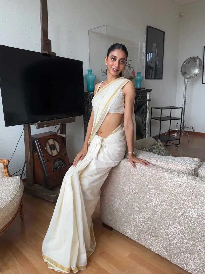 Dolly Singh chooses to go Indian with a graceful plain white cotton Kerala Kesavu Saree at the interview with the India Pavilion at Cannes Festival 2023.